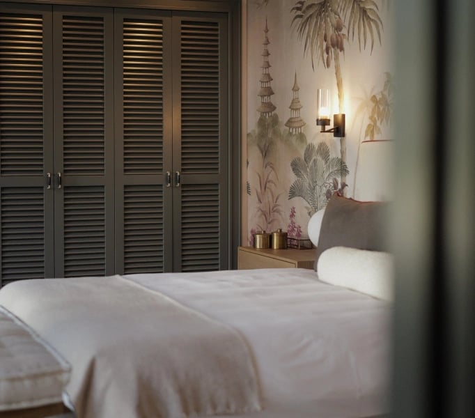 Bedroom at Villa La Gratitud with natural textures and warm lighting