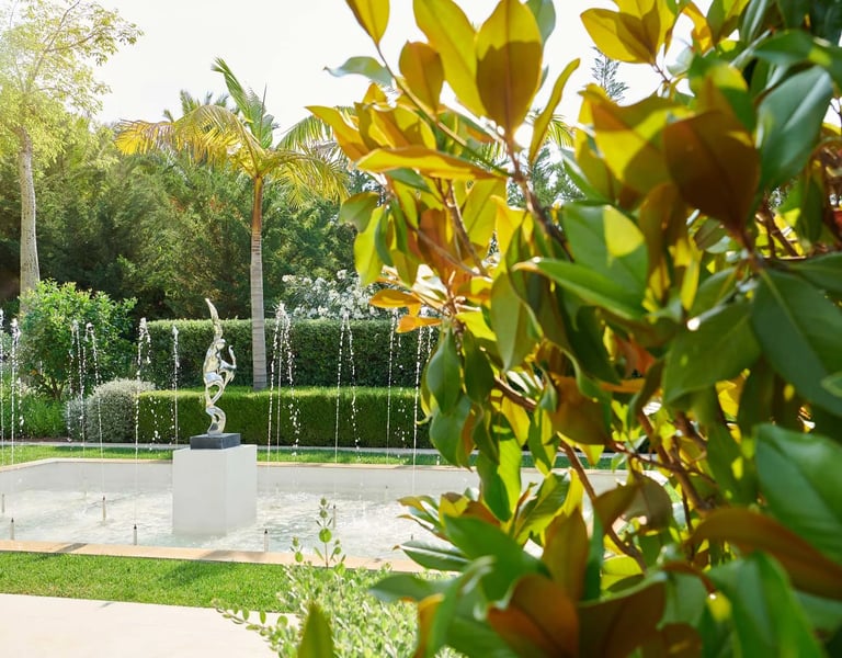 Lush garden with manicured lawns and trees