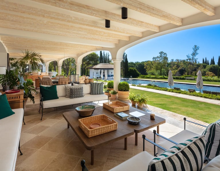 Shaded terrace lounge overlooking the pool