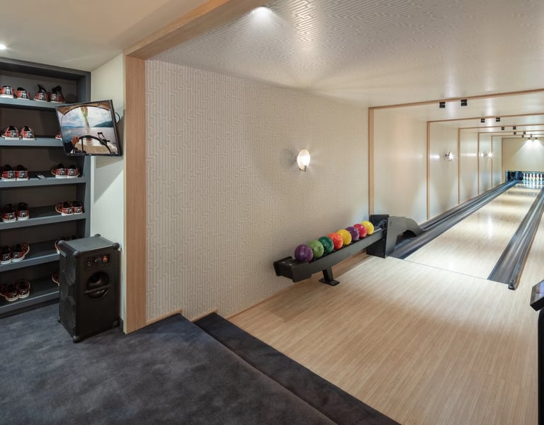 Private bowling alley at Villa La Gratitud with polished lanes and full equipment setup