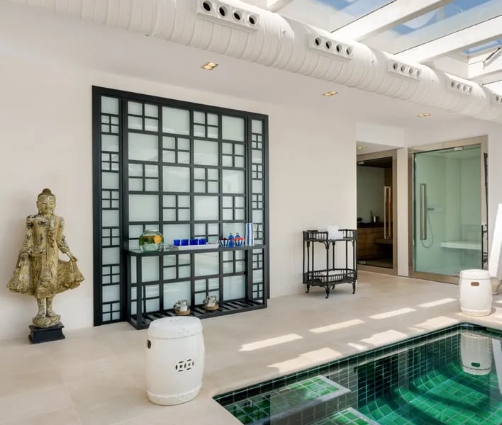 Indoor spa with heated pool, sauna, and relaxation area at Villa El Olivo, Marbella