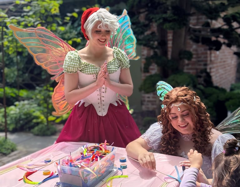 Strawberry and Purple Fairy do a craft with. a child