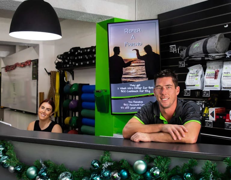 a man and woman in a gym room