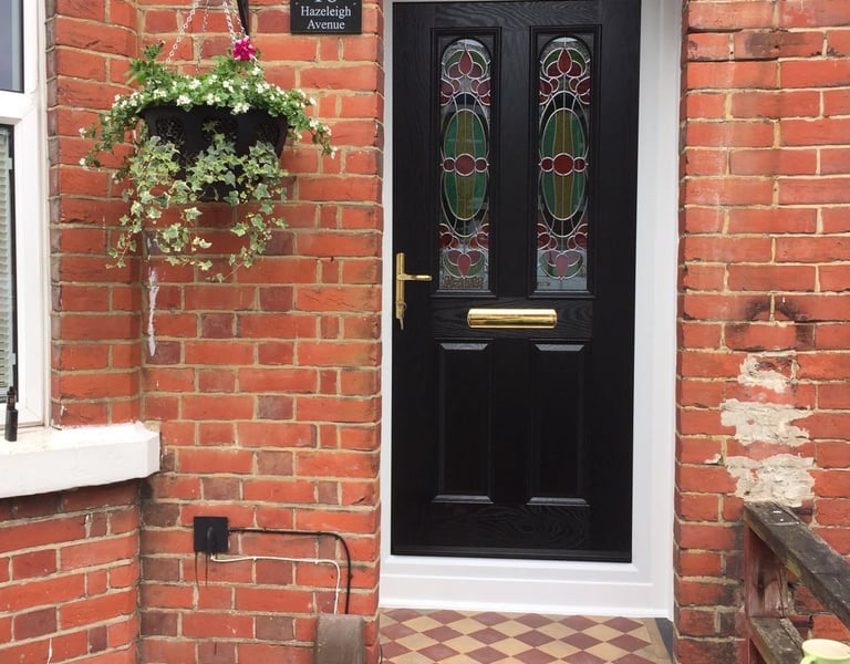 new black front door with bespoke glass which was fitted in Woolston, Southampton by Buildmydoor