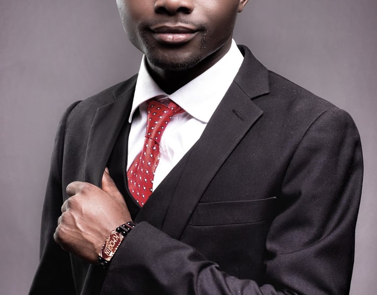 a man in a suit and tie with a red tie