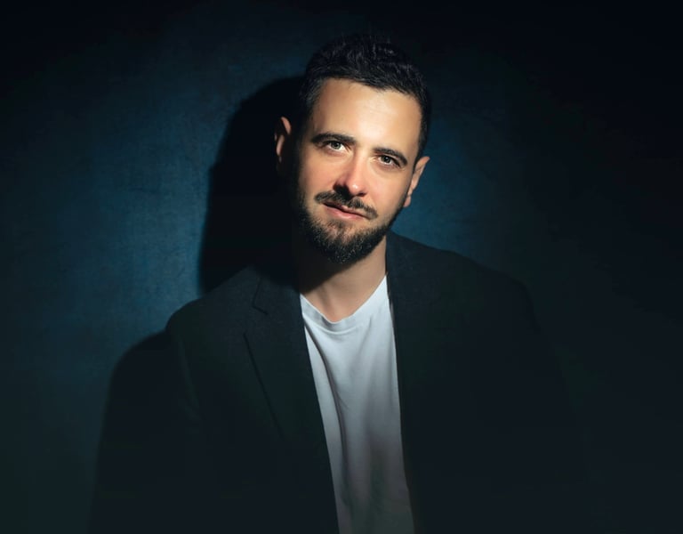 a man in a suit and white shirt