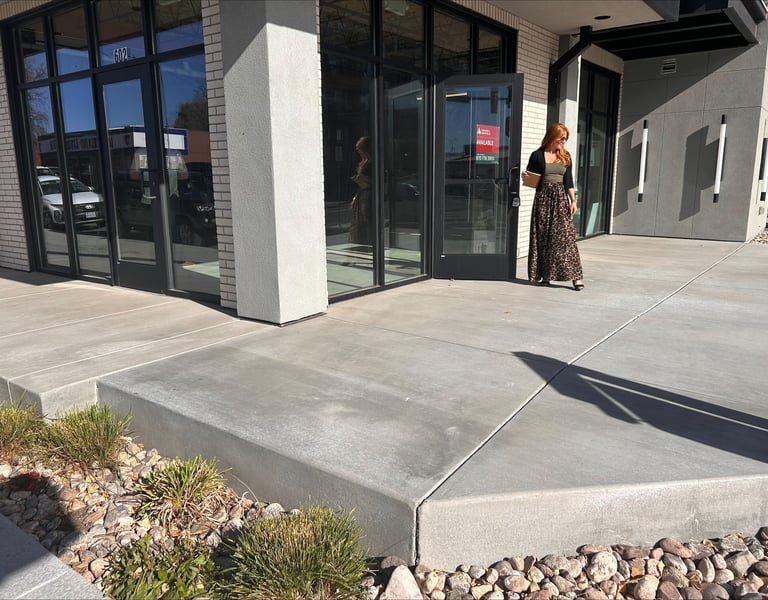 Owner Mindy Bryant standing in front of the new Loveland Edge Optics location