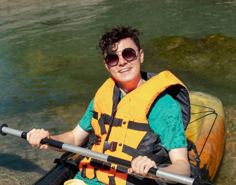 Person kayaking with UV protection in their sunglasses