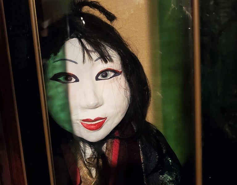 Kabuki style doll face on display in Weird Museum for Boys and Girls