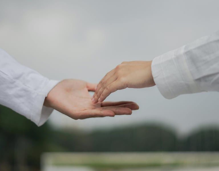 a person holding a hand with a hand holding a hand