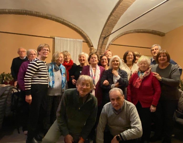 a group of people standing around a group of luggage bags