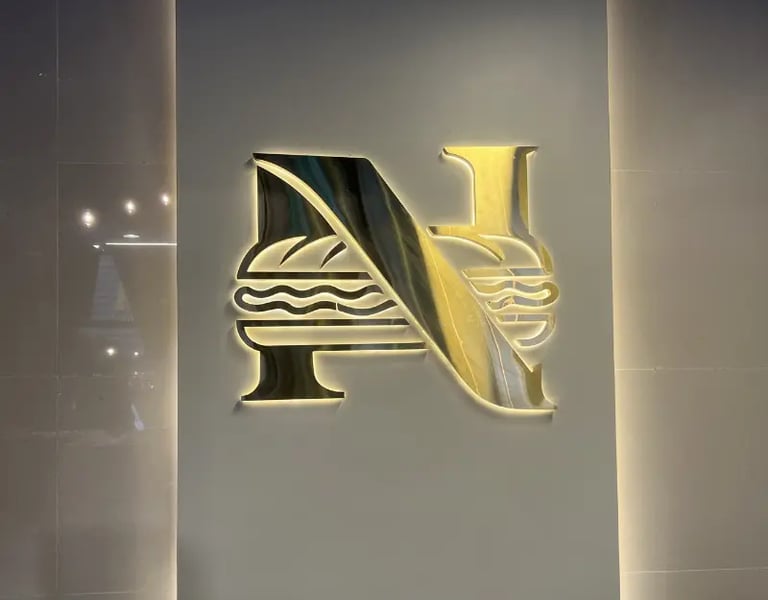 Nobar Odis Restaurant indoor counter 3D SS brushed gold backlite logo