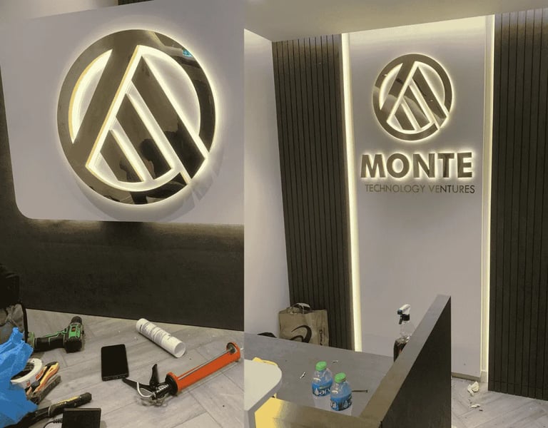 Monte Technologies 3D gold stainless steel brushed finish back lite sign install on their reception