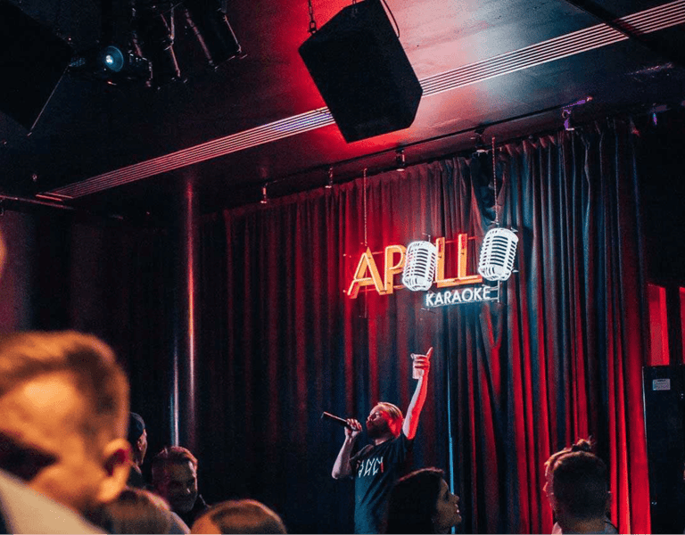A man performing at Apollo Karaoke bar