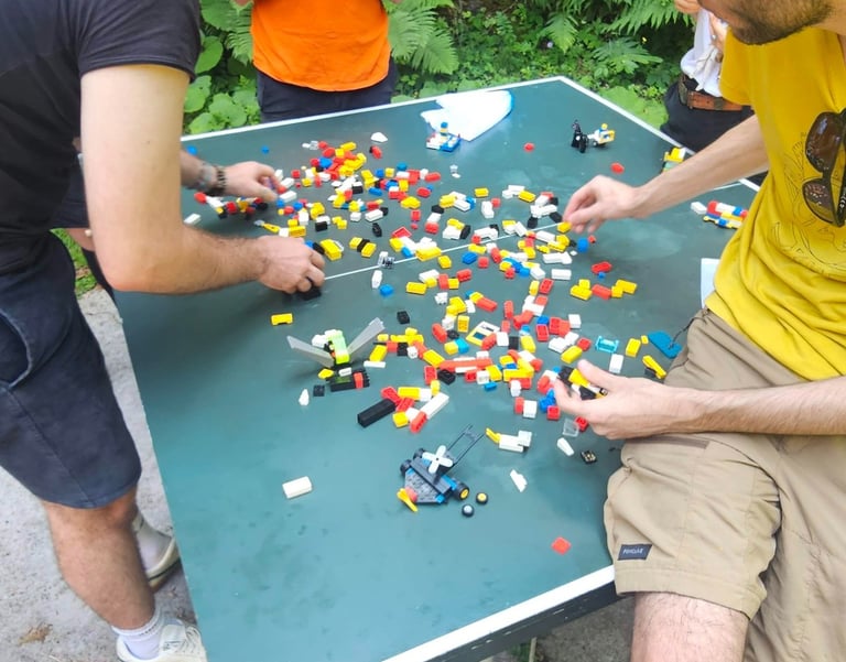 a man and a woman playing a game of legos