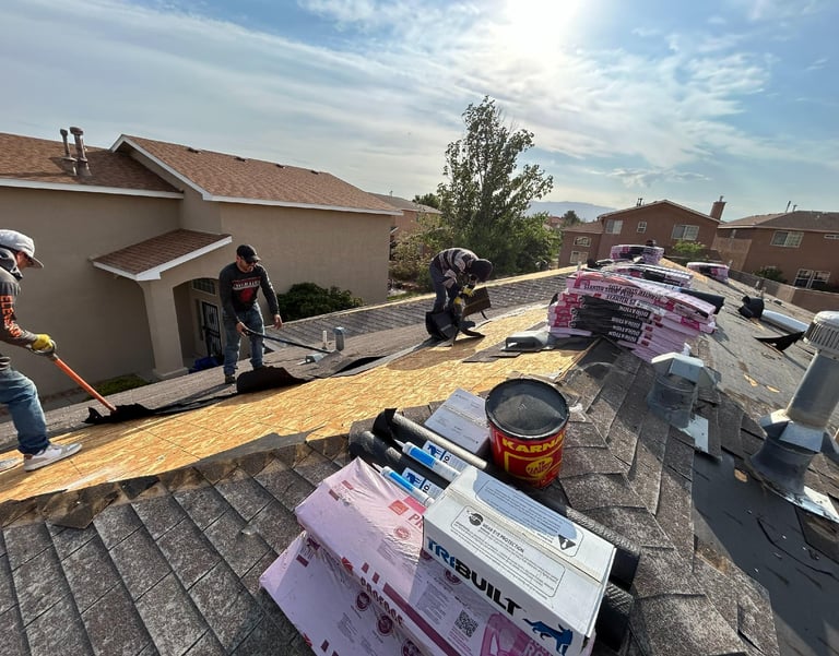 men working on a rooftop