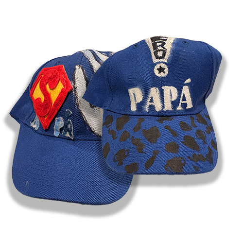 Baseball caps hand decorated by J.N.'s children.