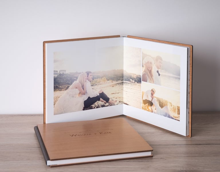 Fine art wedding album open with printed photos — South of France wedding photographer pricing