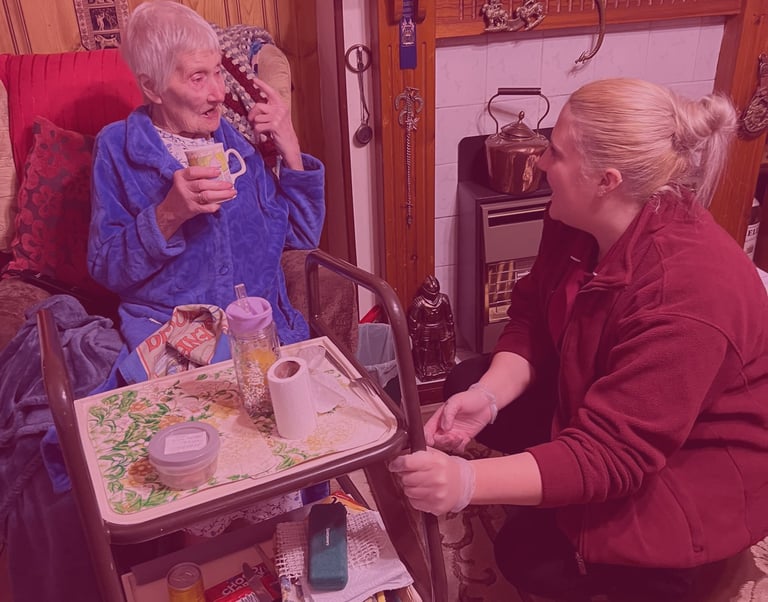 A woman having a conversation with an AMG Nursing employee