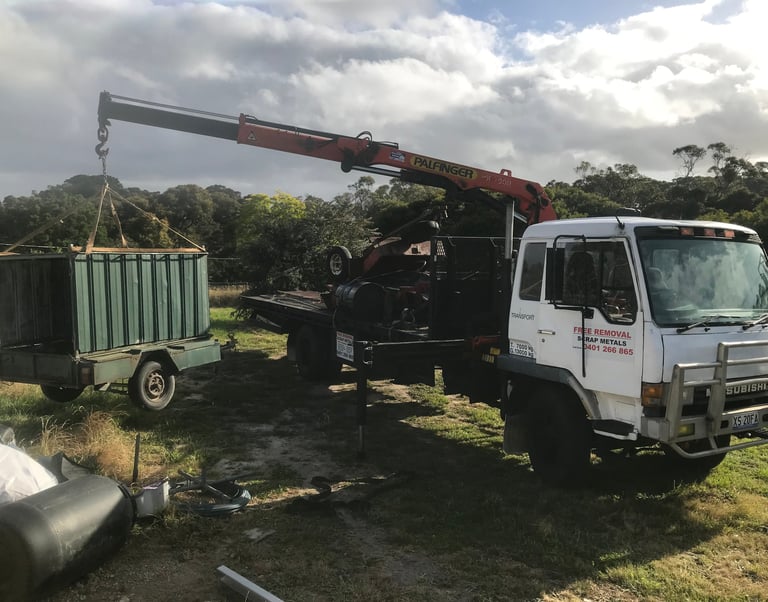 Crane truck loading scrap metal