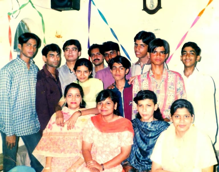 a group of people standing around a table