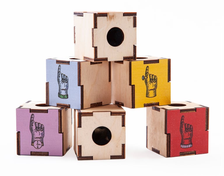 Colour boxes with hand illustrations and finger holes.