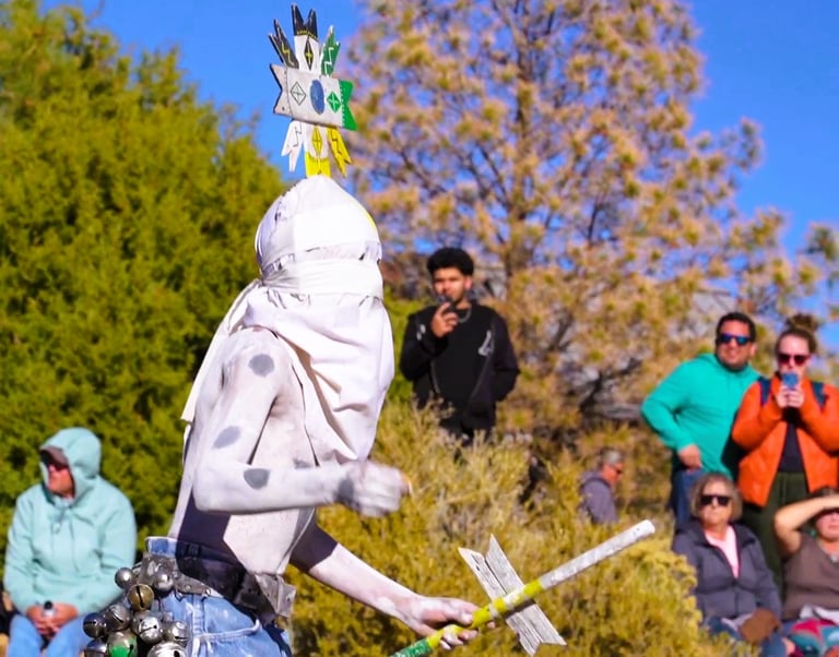 a person in ceremonial costume performing on at Grand Canyon National Park