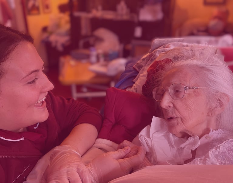 Image of an AMG nurse talking and caring for a patient