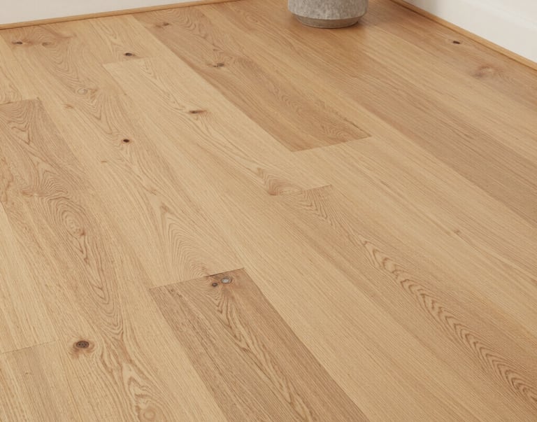 A cozy living room featuring new flooring and custom built-ins.