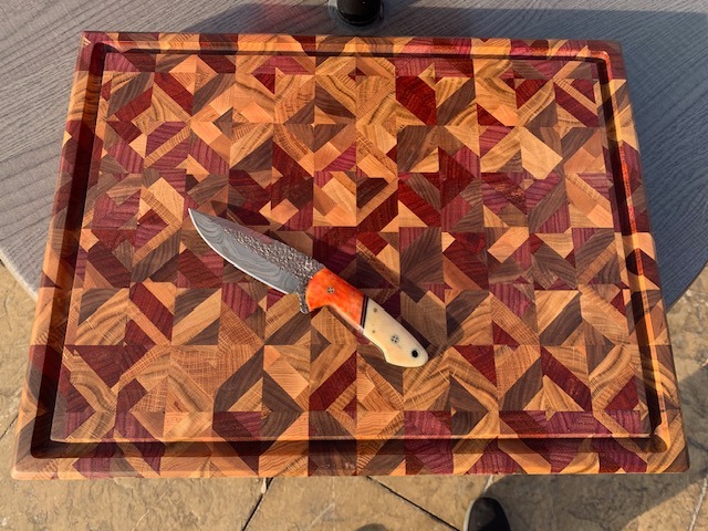 Large end grain chaos board made with cherry, maple, white oak, bourbon barrel, and purple heart.
