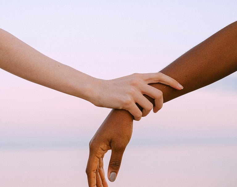 two hands holding hands with a person holding a finger