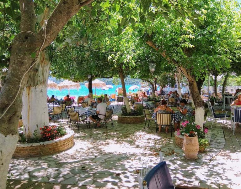 a group of people sitting at tables in a restaurant
