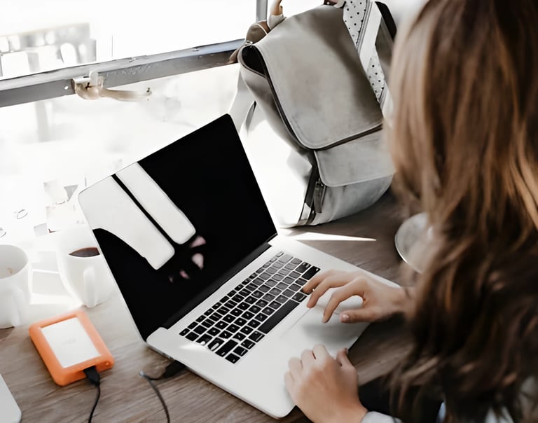 Hands typing on a laptop, symbolizing end-to-end assistance by Admit 360 for studying abroad,