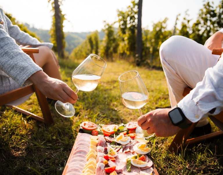 a man and woman sitting at a table with food
