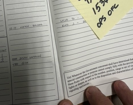 a person holding a notepad with a note on it