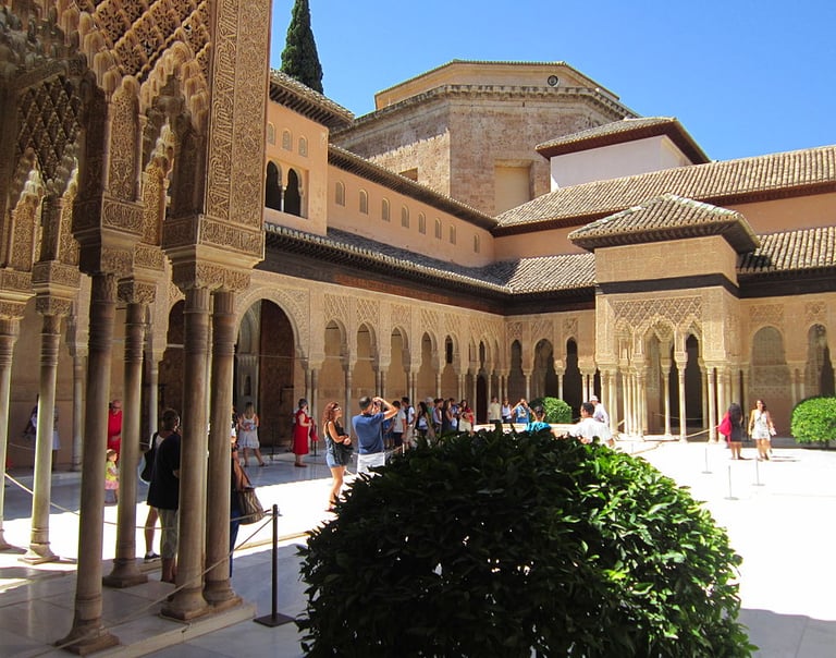 morocco fes a courtyard with a lot of people walking around