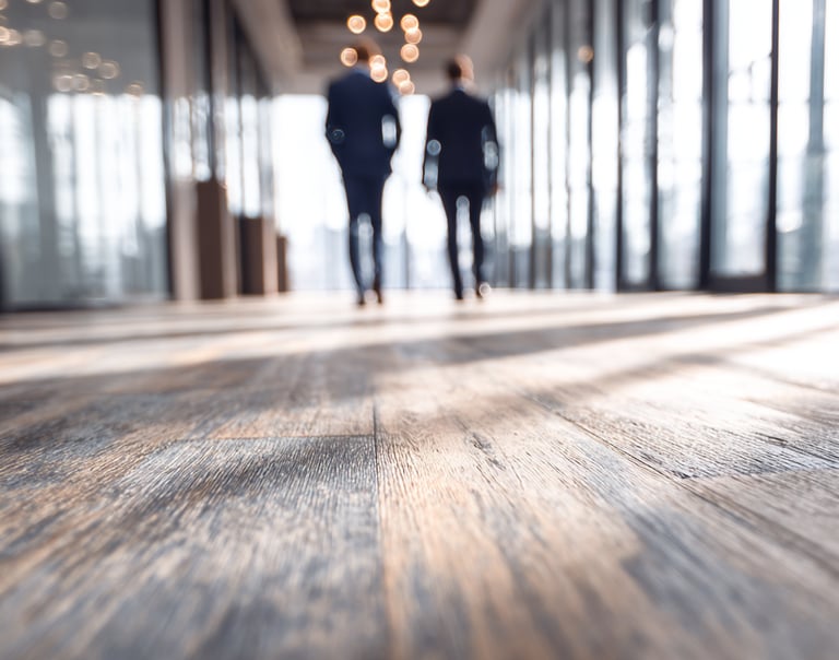 Businessmen walking on a beautiful installed commercial floor from Next Floors