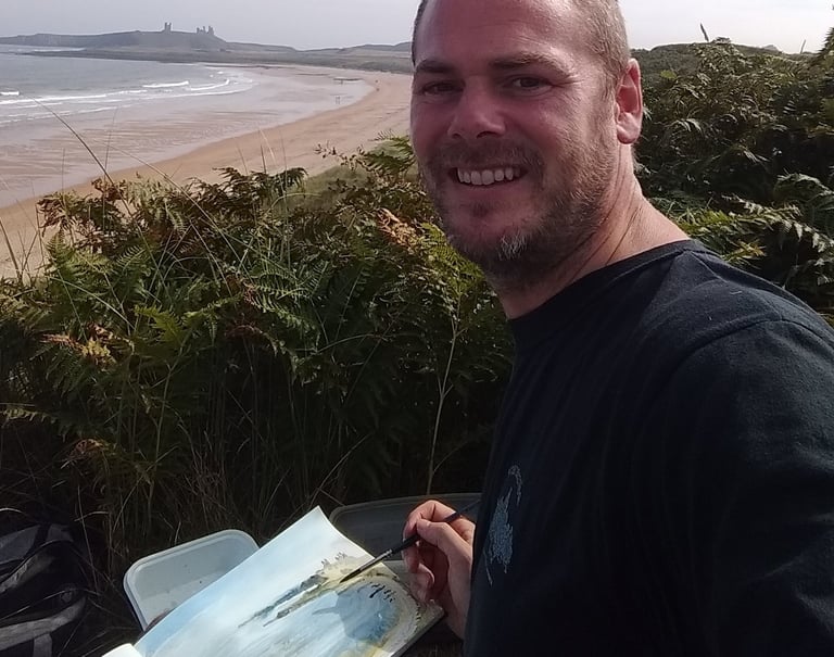 Mark Exon sketching Dunstanburgh Castle