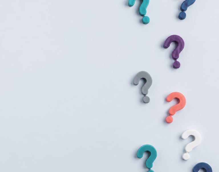 three question marks on a light gray background