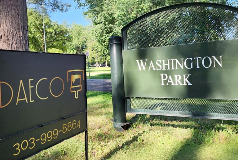 Washinton Park and DAECO sign side by side
