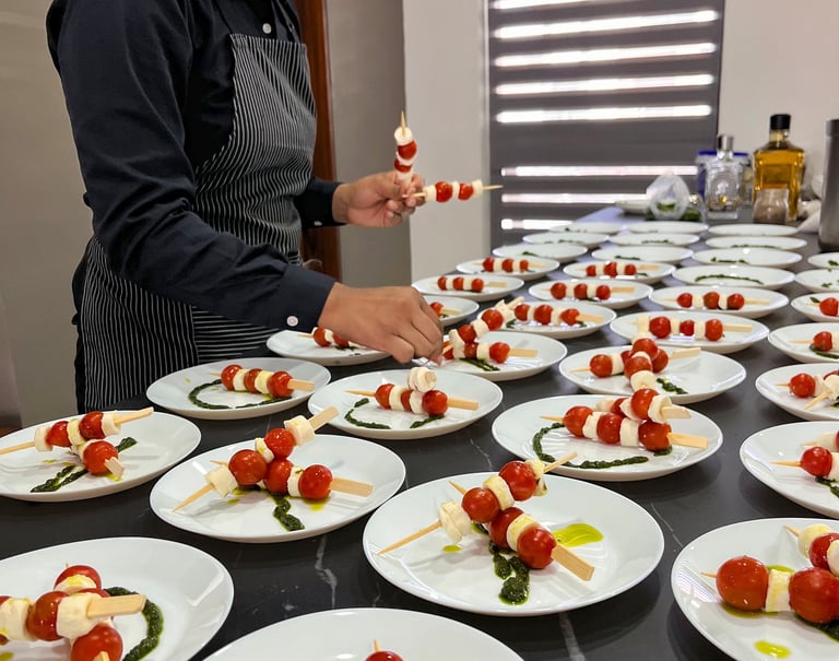a woman in a chef's apron preparing food