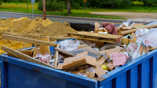 trash pile in construction roll of container