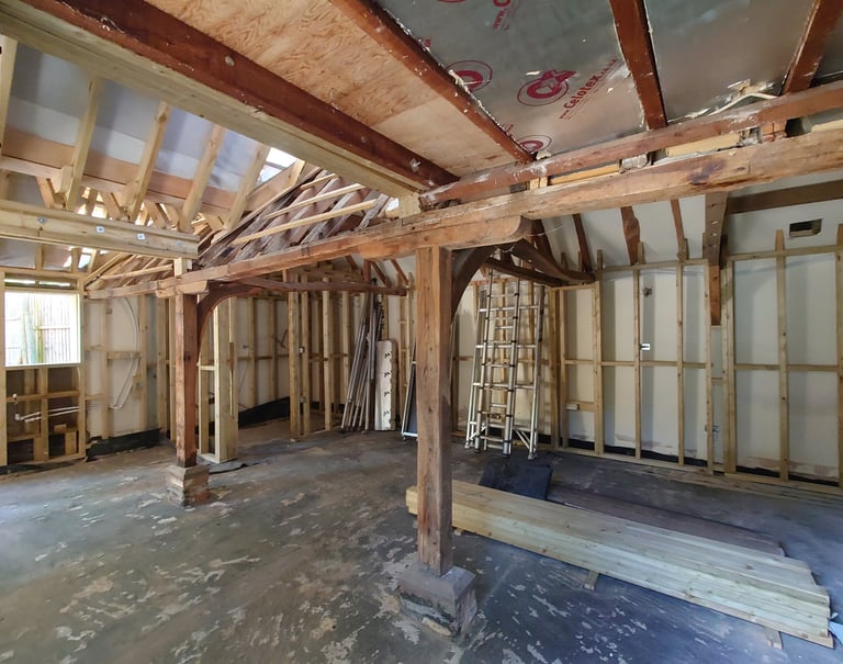 a room with a wooden frame and a ceiling fan