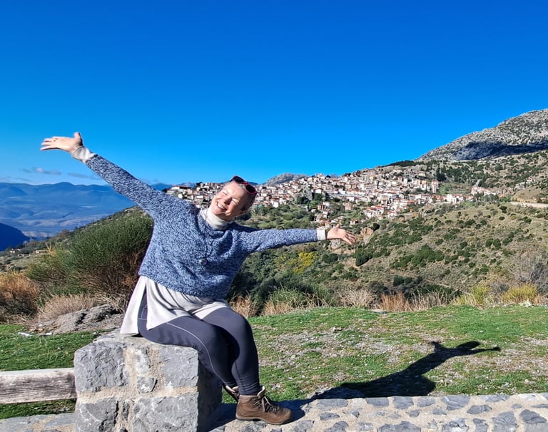  happy woman sitting in mountains