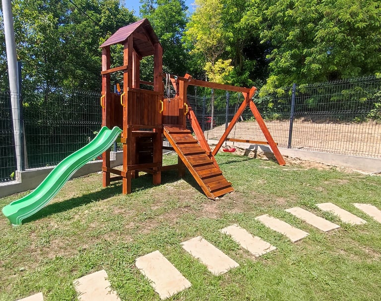 a wooden swing set with a slider and slider