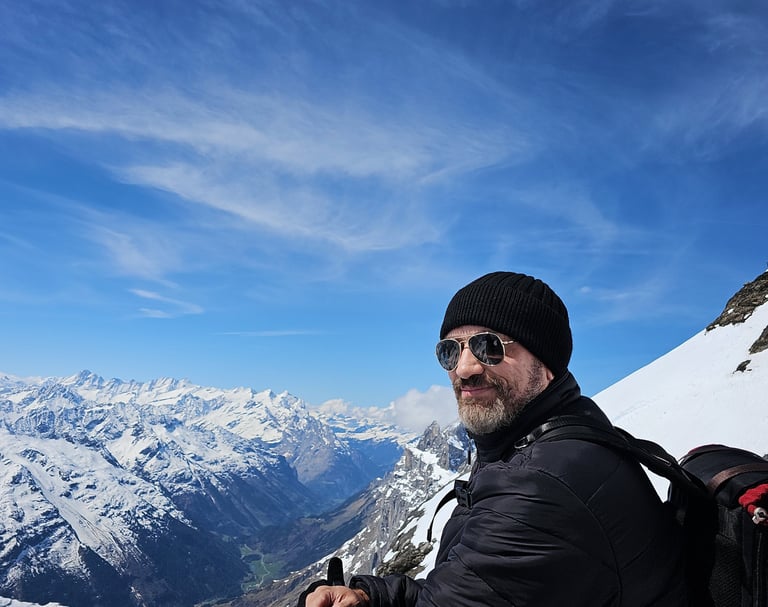 a man with a backpack on a mountain
