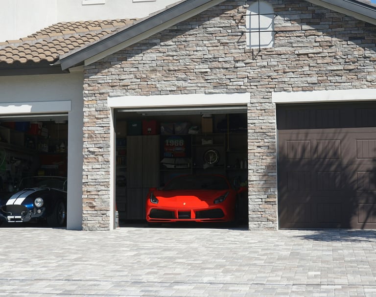 Modern residential garage design featuring desert-resilient stone masonry and premium finishes.