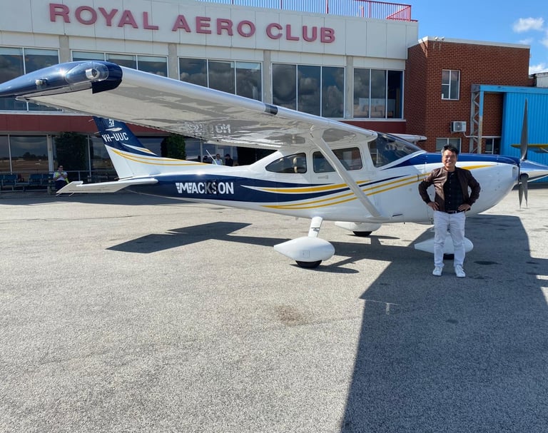 a man standing in front of a royal aero club