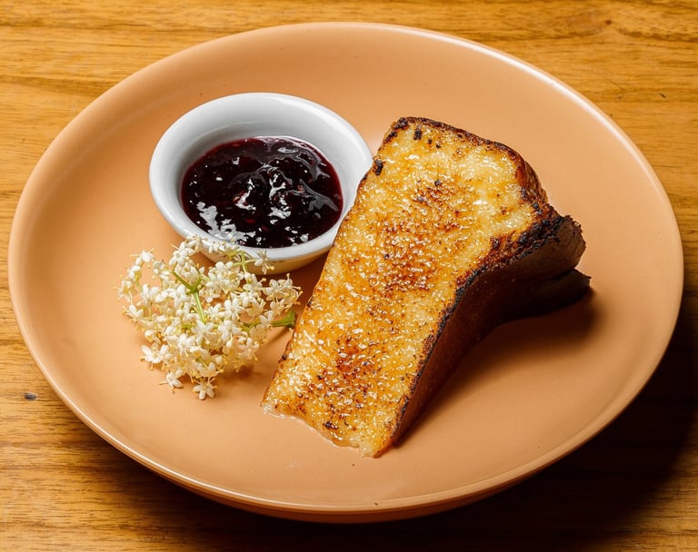 a plate of a slice of cheesecake and a bowl of jam