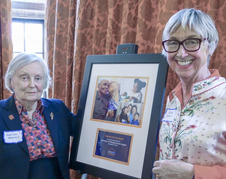 Marilyn Helmholz and Lesley Bloch accept. Graham Taylor award from Chicago Commons, 2019 Benefit